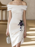 Chic White Satin Dress Featuring Asymmetric Hem and Floral Embroidery
