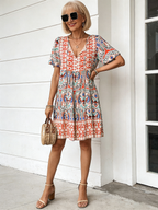 Vibrant Floral Bohemian Mini Dress -  New Arrival, V-Neck, Loose Fit, Casual Style, Floral Print, Mini Length, Perfect for Summer and Outdoor Activities