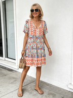 Vibrant Floral Bohemian Mini Dress -  New Arrival, V-Neck, Loose Fit, Casual Style, Floral Print, Mini Length, Perfect for Summer and Outdoor Activities