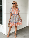Vibrant Floral Bohemian Mini Dress -  New Arrival, V-Neck, Loose Fit, Casual Style, Floral Print, Mini Length, Perfect for Summer and Outdoor Activities