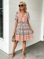Vibrant Floral Bohemian Mini Dress -  New Arrival, V-Neck, Loose Fit, Casual Style, Floral Print, Mini Length, Perfect for Summer and Outdoor Activities